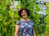 Jocelyn Doyle headshot against leafy background