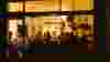 Exterior shot of venn canteen busy at night