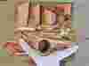 Overhead shot of a butcher at a butcher's block breaking down a whole pig