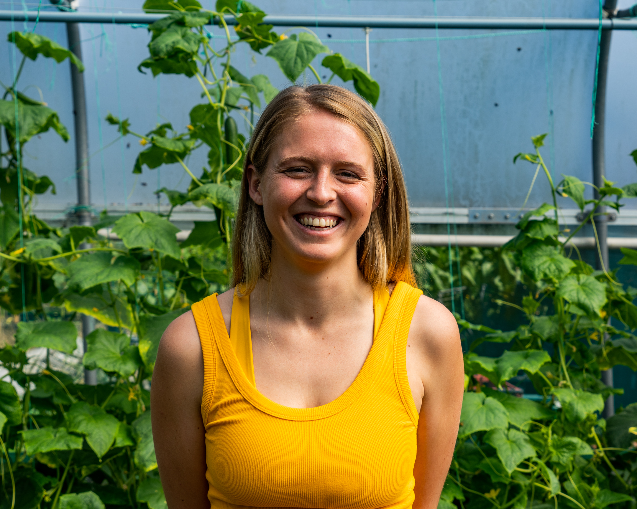 Ellie Harrison headshot against leafy background