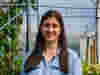 Agatha Georgiou headshot against leafy background