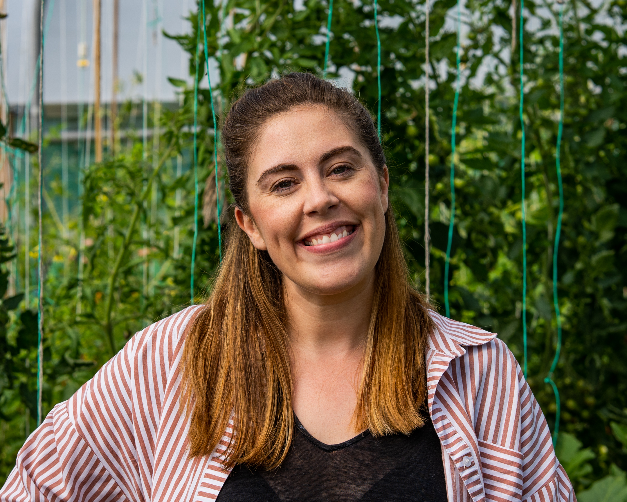 Karen Finnerty headshot against leafy background