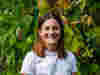 Martina Dell headshot against leafy background