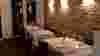 Cosy interior shot of tables set at Lavang, soft lighting