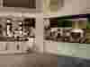 Chefs working in an open kitchen at Six Senses Zighy Bay