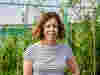 Jackie Freeman headshot against leafy background