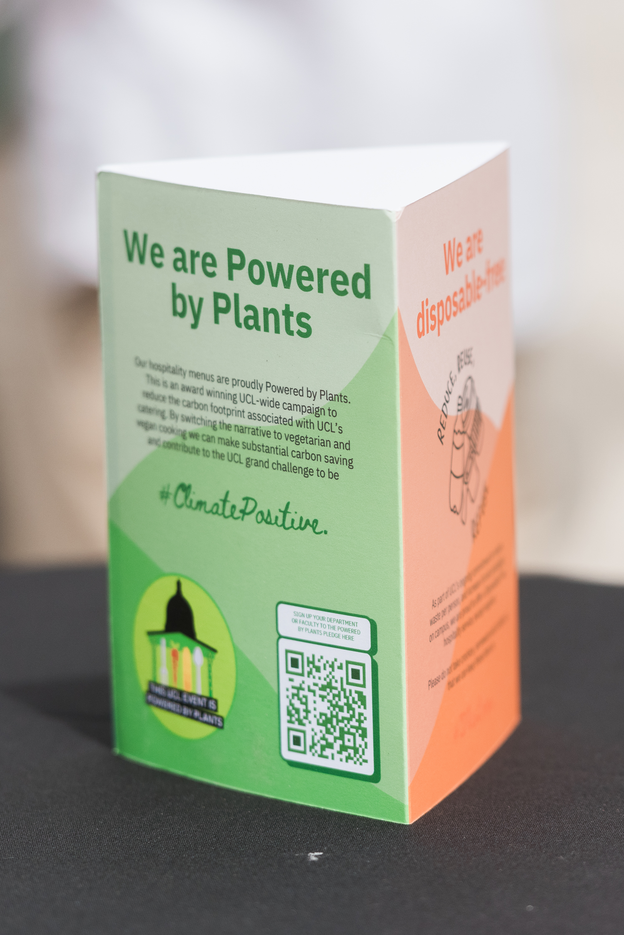 On-table signage saying "we are powered by plants"